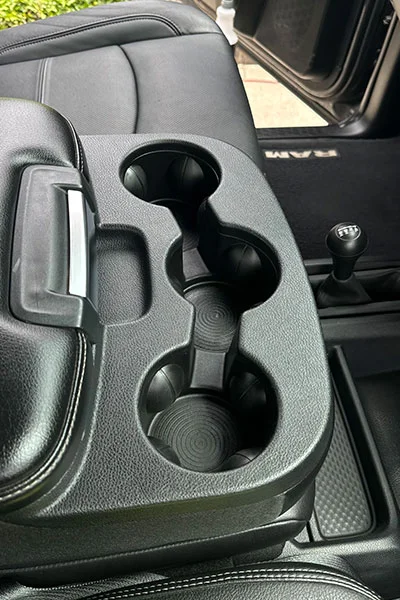 Gray cup holder trim after professional restoration in San Jose