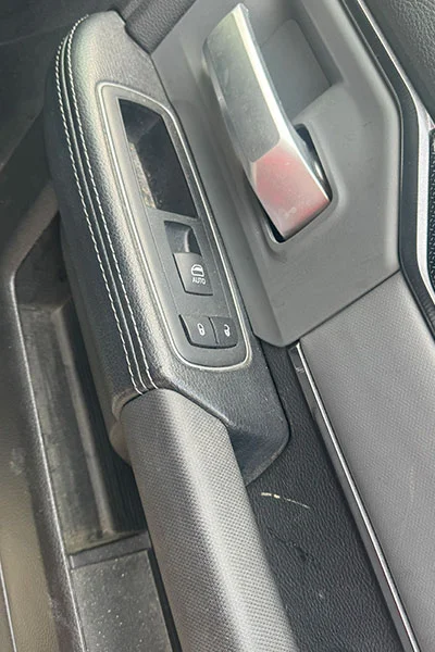Faded gray door handle trim before professional restoration in San Jose