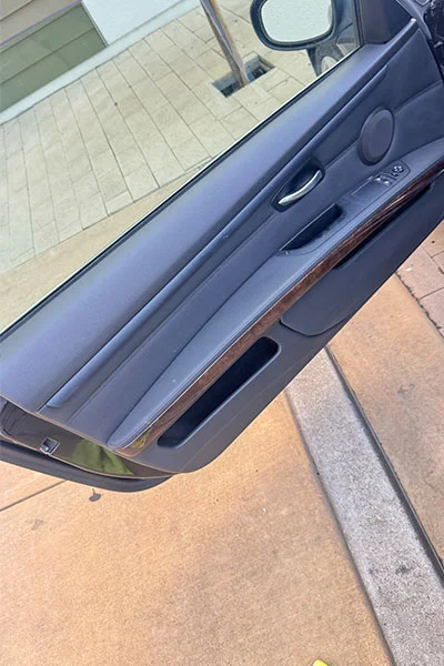 Faded black door sill trim before professional restoration in San Jose