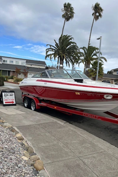 Mobile boat detailing service on red boat at customer location Bay Area marina