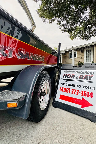 Nor Bay Mobile Detailing service sign displayed at boat detailing location showing phone number 408-373-3614 and we come to you message
