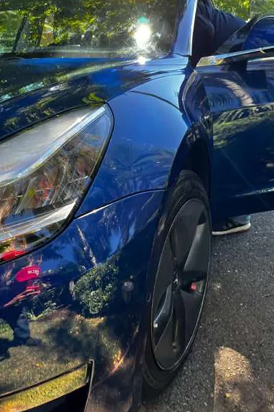 Water spot removal service on tesla front hood after picture