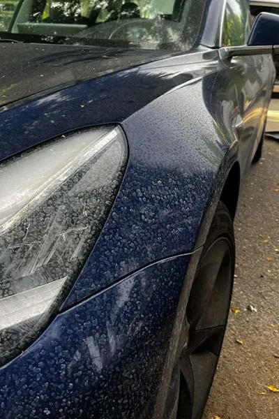 Water-spot-removal-service-on-tesla-front-hood-before-picture
